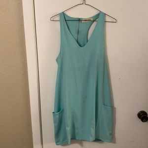 Turquoise blue dress with pockets.